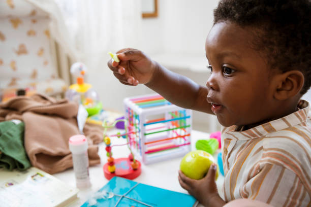 istock Little Boy can't eat the apple peel 1493188799