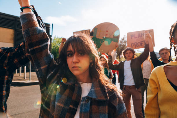 istock angry young woman protests in a march demonstration for global warming 1493194285