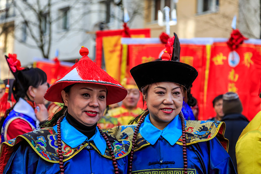 Paris, France-February 25,2018: Environmental portrait of two women disguised as traditional characters during the 2018 Chinese New year parade in Paris.