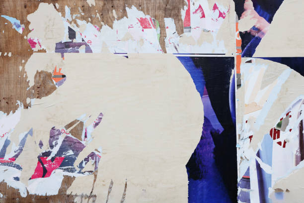 istock Pieces of torn paper peeling off wall used as billboard 1493197715