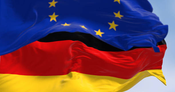 istock Germany and EU flags waving in the wind on a clear day 1493198094