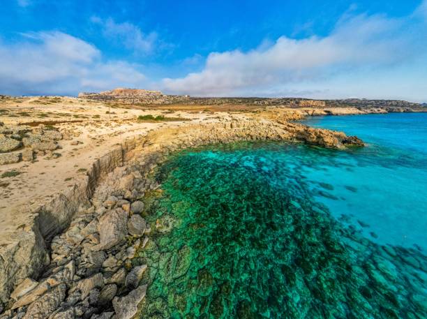 istock a view from the beach near the shore and clear blue water 1493199703