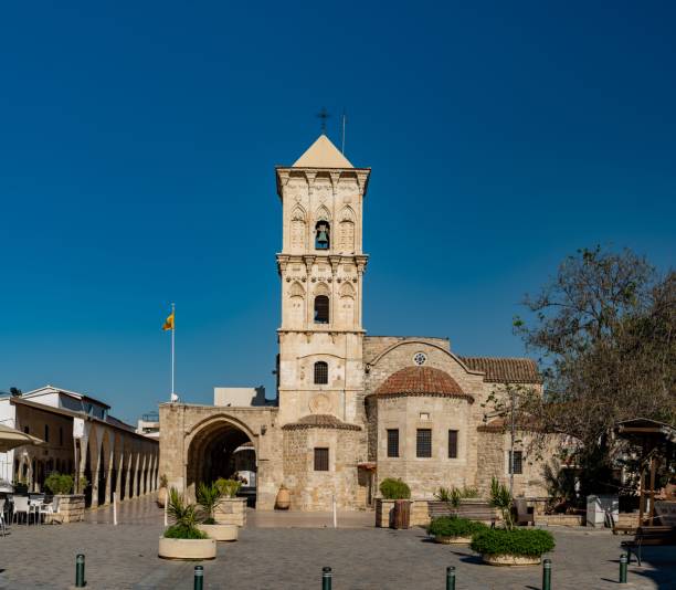 istock a white building with a tall clock tower sitting next to a street 1493200135