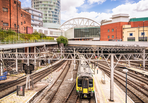 A train on one of multiple tracks in Birmingham's city centre, in the West Midlands of England.