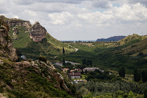 Serene valley town with its buildings surrounded by hills in Clarens, Free State, South Africa