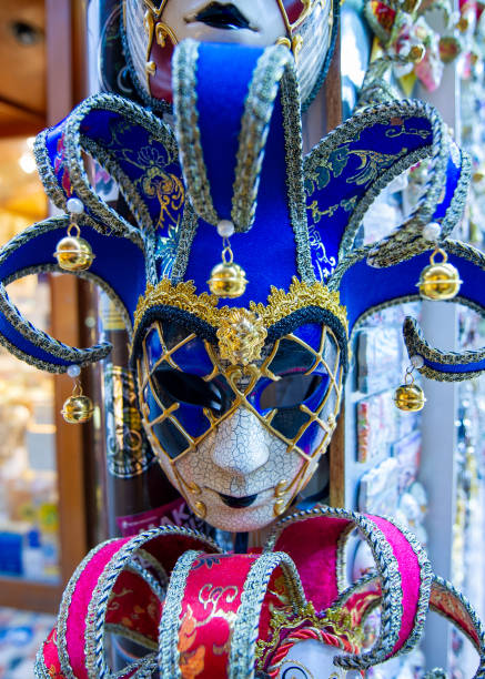Venice, Italy - March 8, 2011: A Person with typical venetian carnival costume at the Carnival of Venice. Shot in St. Mark's Square. The Carnival of Venice is a annual festival held in Venice and is one of the most popular and appreciated carnival in the world.