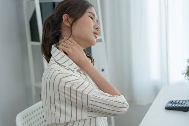 istock office syndromes, woman massaging neck pain due to work and using a computer, digital composite of a focused spine of neck pain and shoulder pain symptoms , injuries, health care, medical, myositis 1493210041