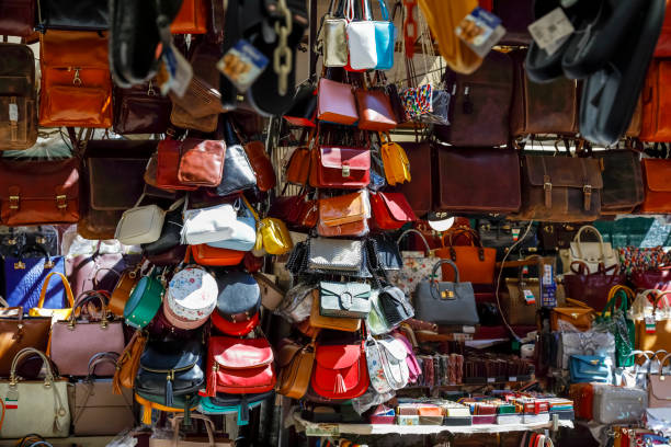 Florence, Italy - April 19, 2023: Shop window of one of the street stalls where various handbags, briefcases, wallets and other leather goods are offered for sale