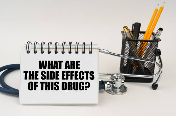 istock On the table is a stethoscope and a notebook with the inscription - What are the side effects of this drug 1493215350