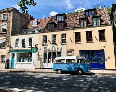 Bristol, UK - July 12, 2019: A retro VW  camper van parked in the road near an art gallery in Bristol, England.