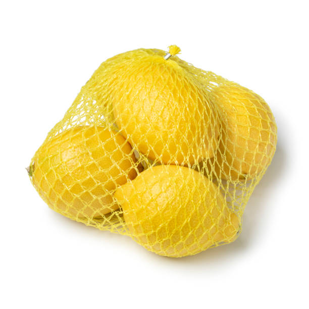 istock Yellow net with whole fresh lemons close up on white background 1493220753
