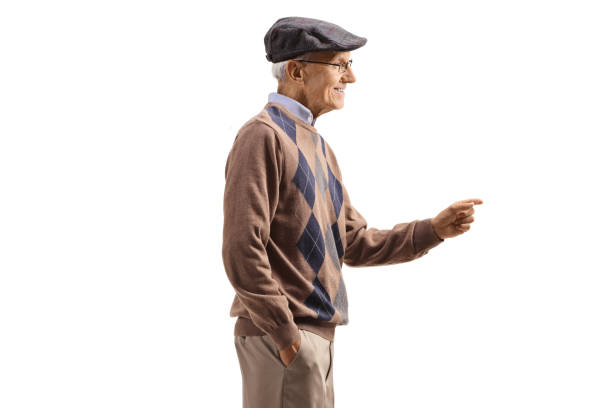 istock Profile shot of an elderly gentleman gesturing with hand and smiling 1493222974