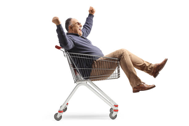istock Excited mature man sitting inside a shopping cart 1493222999