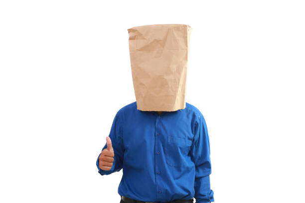 Businessman with a paper bag showing thumbs up
