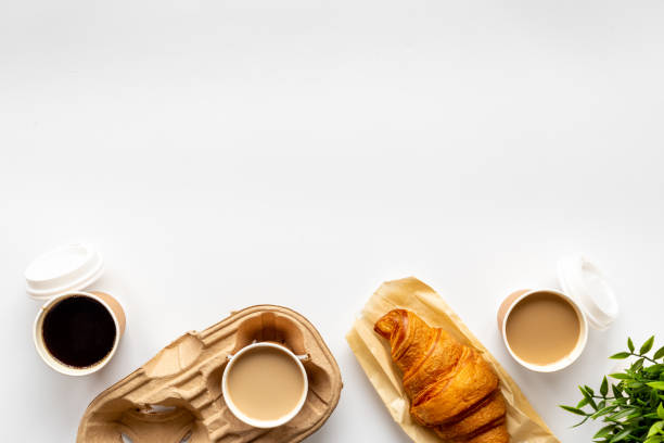 istock Different types of coffee in paper cup with croissant 1493226173