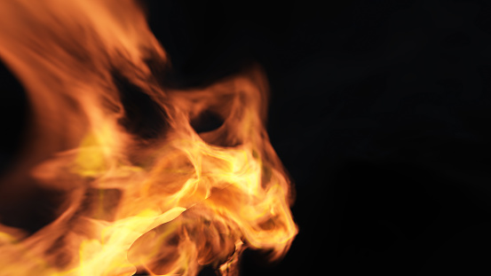 Fire burning on a black background. Ideal for compositing with another image. The background can be removed with a blending mode like screen.