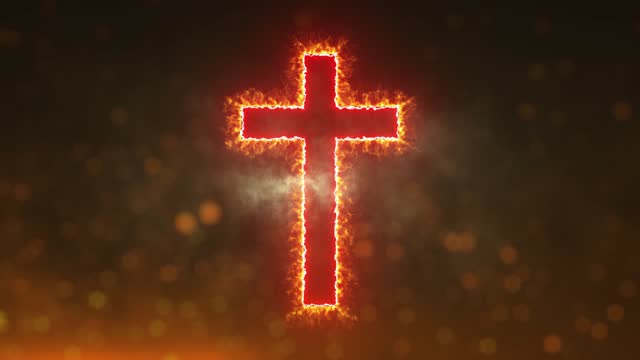 Glowing fiery cross on background with sparks
