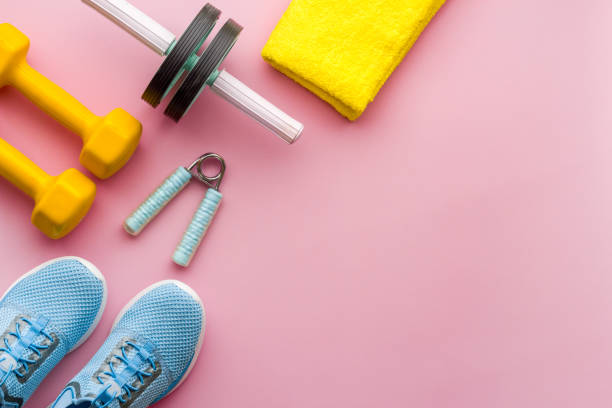 istock Athletics set with sneakers and dumbbells, top view 1493231357