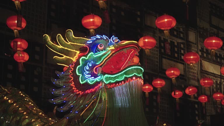 lighted chinese dragon dance in night time ,chiness lantern decorated.happy chinese day festival.Lion dance.