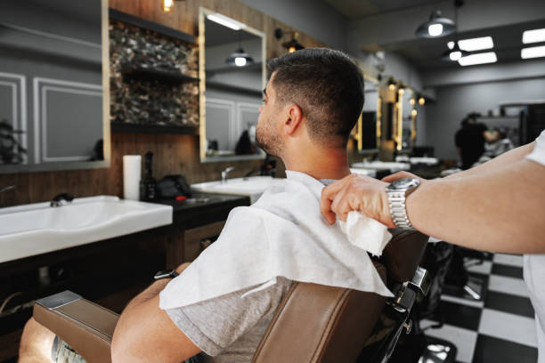 istock Young man client sitting in a barber shop 1493240000