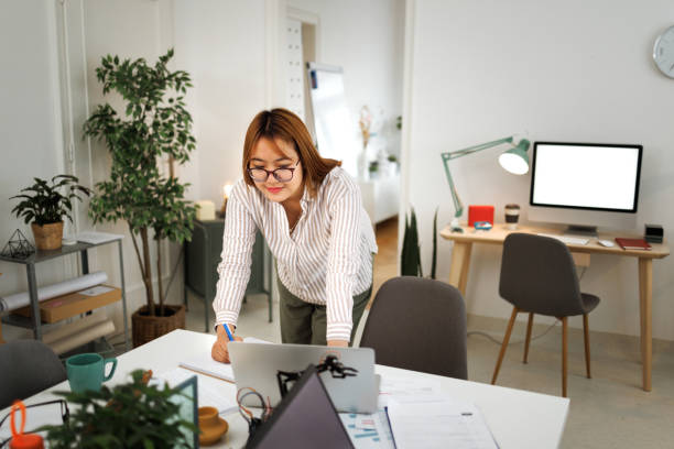 istock Young smiling businesswoman working at modern home office 1493240549