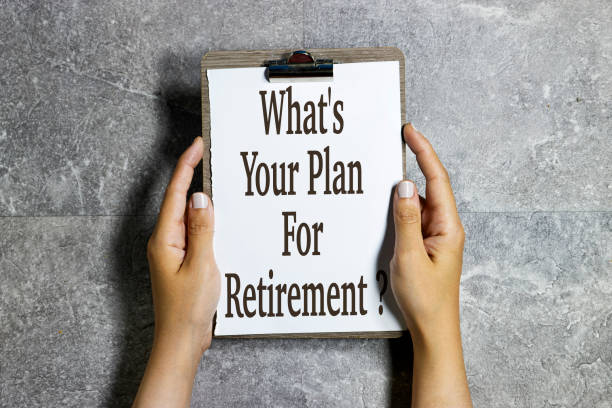 istock closeup hands holding a paper clipboard with What's Your Plan for Retirement ? concept 1493242371