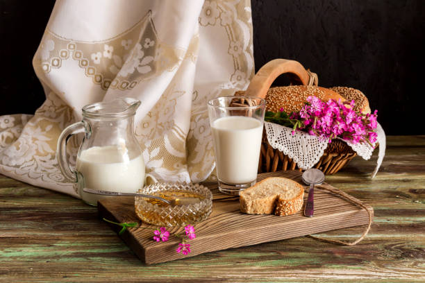 istock Milk, honey and bread on the table 1493246925