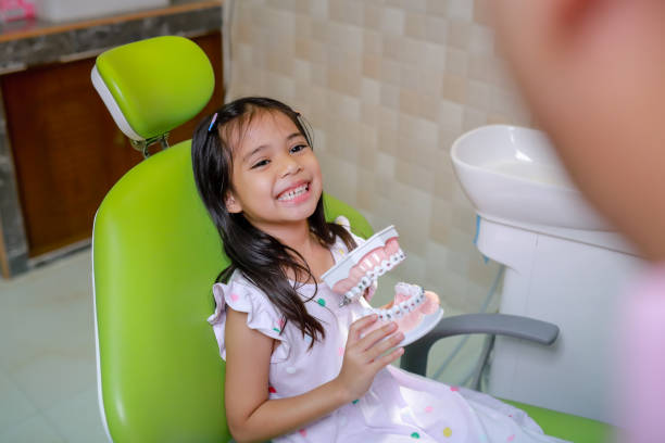 istock This cute girl is getting ready for her regular dental appointment at the dentist's office checkup.pediatric medical care concept. 1493248907