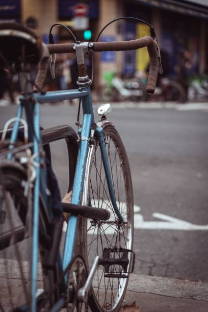 istock Blue bicycle parked against a storefront on a city street 1493250849