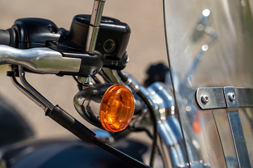 Closeup of motorcycle turn signals at the front