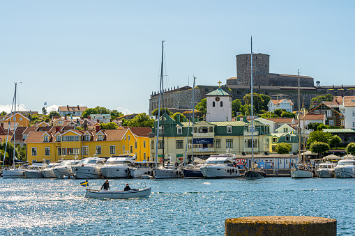 Kungälv, Sweden - July 15 2022: Wooden houses and yachts at Marstrand.