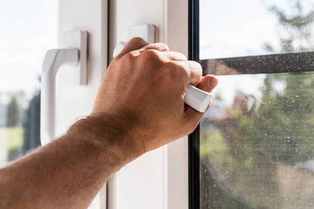 istock Male hand opening modern plastic window on a sunny day 1493256895