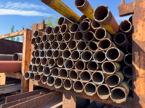 A lot of iron pipes on scrap metal