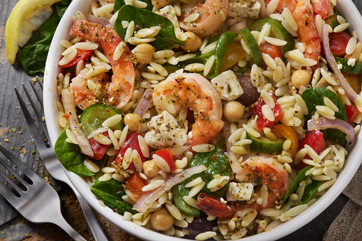 Mediterranean Orzo and Shrimp Salad with Baby Spinach, Feta, Cherry Tomatoes, Cucumber, Olives, Red Onion, Red Peppers and Chick Peas