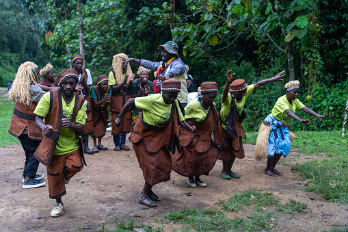 Rushaga, Bwindi Impenetrable Forest National Park, Uganda - March 24, 2023: Batwa pygmies tribe people performing a traditional dance