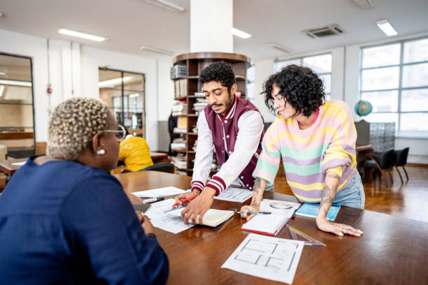 istock Friends studying together in the library 1493265516