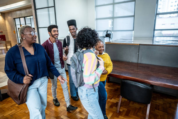 istock Friends walking and talking in the library 1493266590