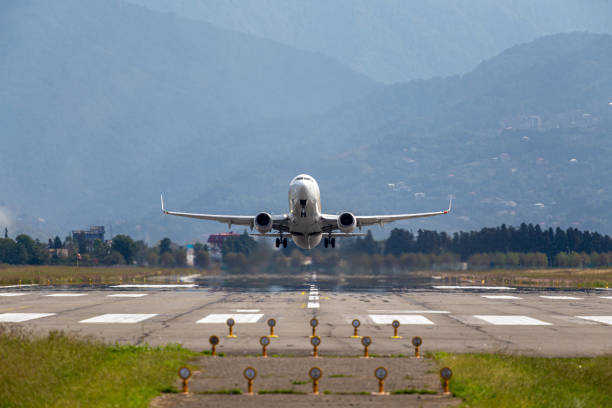 istock passenger plane takes off front view against 1493266609