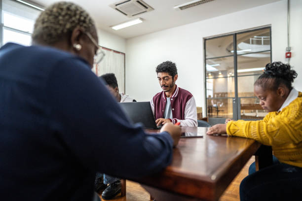 istock Friends studying together in the library 1493267490