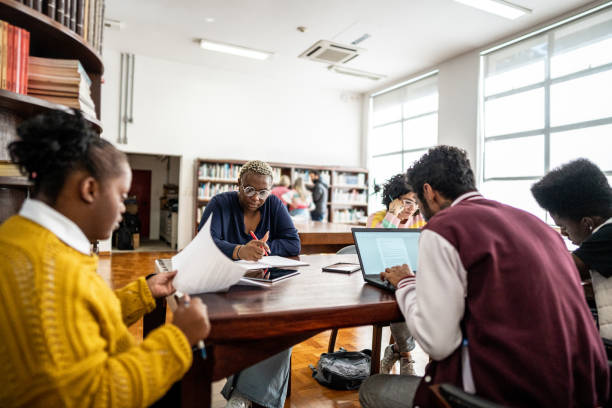 istock Friends studying together in the library 1493268831