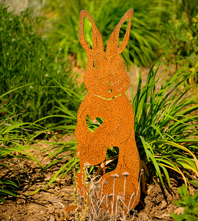 An ornamental rabbit in a garden