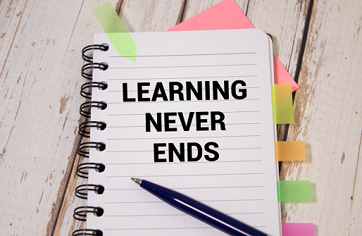 Learning Never Ends, text words typography written on paper, educational life and business motivational inspirational concept