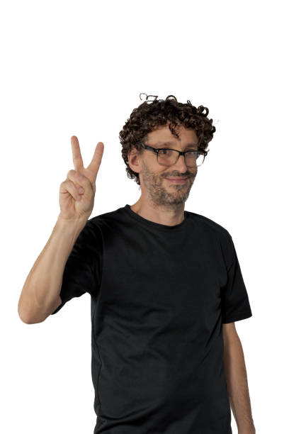 istock Middle-aged man with his right hand fingers in V, on white background. 1493284060