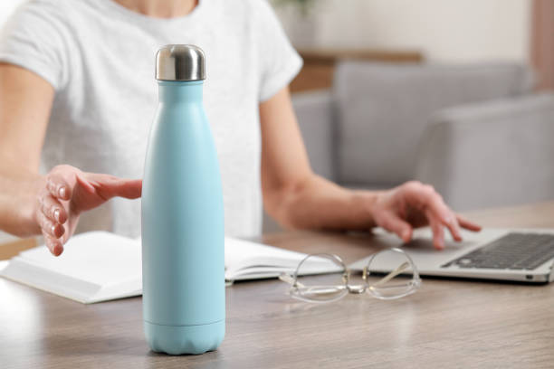 istock Woman taking thermo bottle indoors, closeup view 1493296995