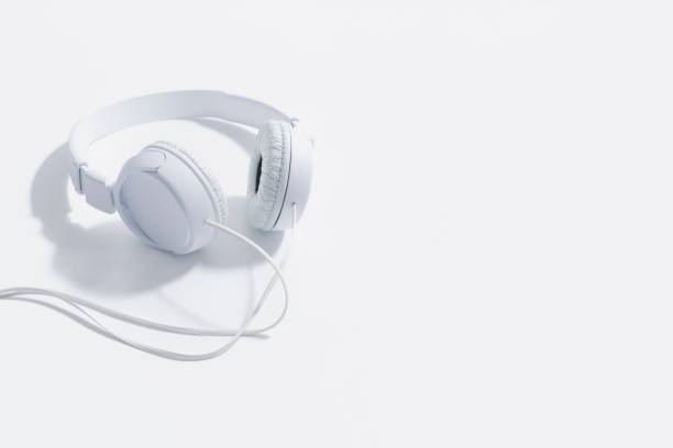 istock White headphones with wire isolated on white background. Place for text 1493299067