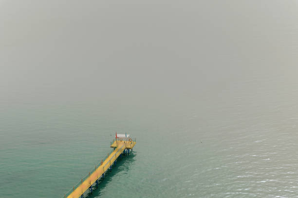 Wooden pier in Durres sea foggy