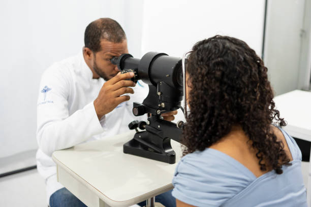 istock Woman performing vision exam 1493302187