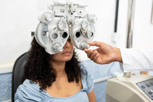 istock Woman performing vision exam 1493302417