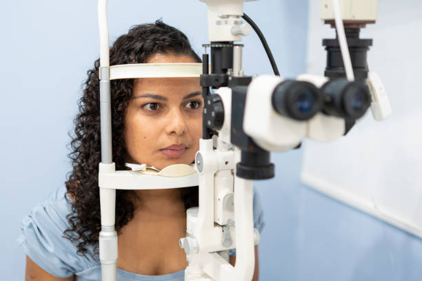 istock Woman performing vision exam 1493302477