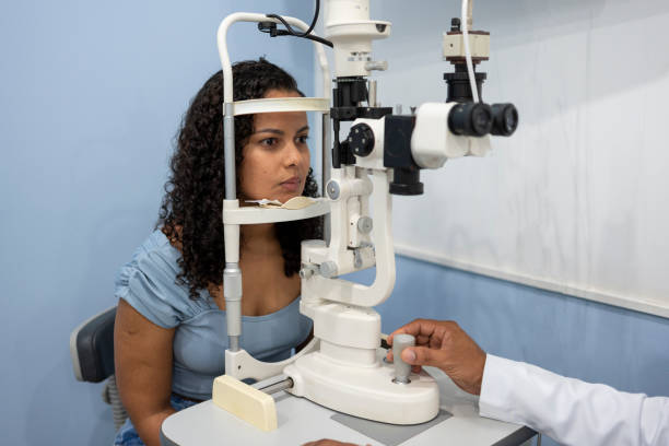istock Woman performing vision exam 1493302480